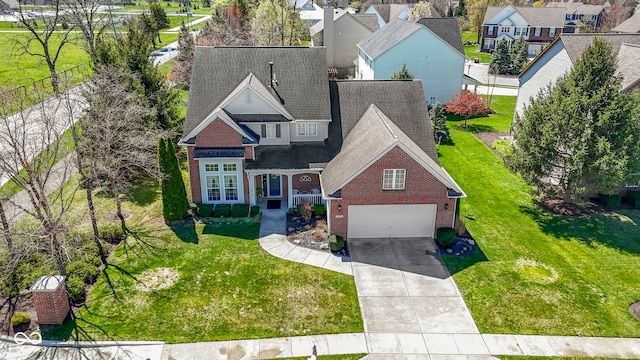 view of front of home with a garage, driveway, a shingled roof, and brick siding