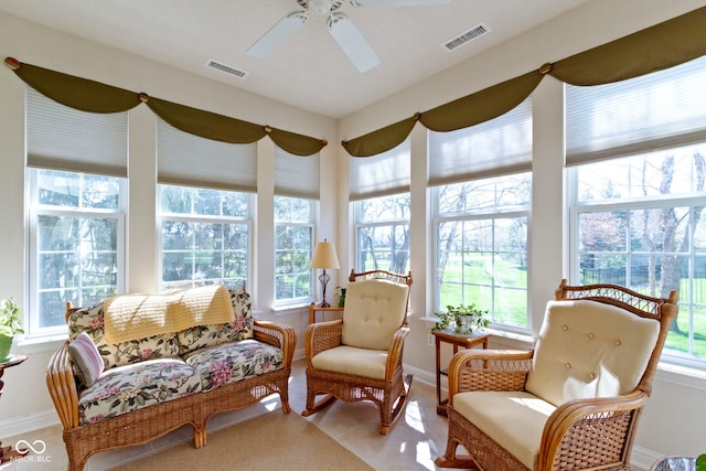 sunroom / solarium featuring baseboards and visible vents