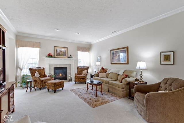 living area featuring visible vents, a tiled fireplace, ornamental molding, and light colored carpet