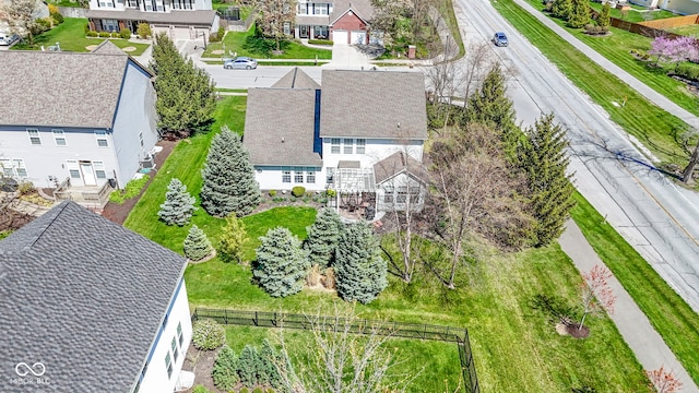 birds eye view of property with a residential view