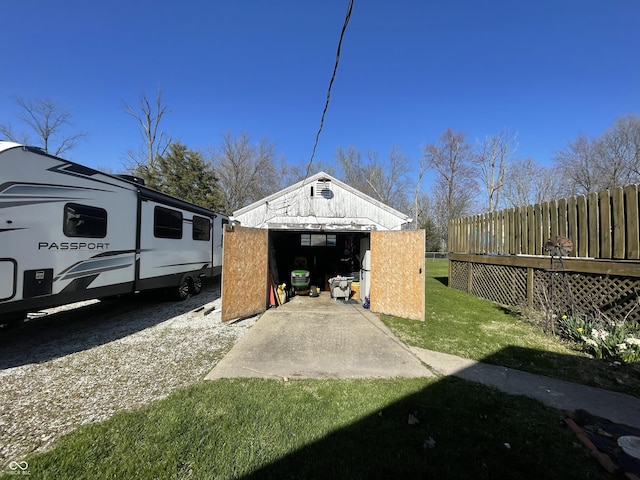 exterior space with an outbuilding and fence