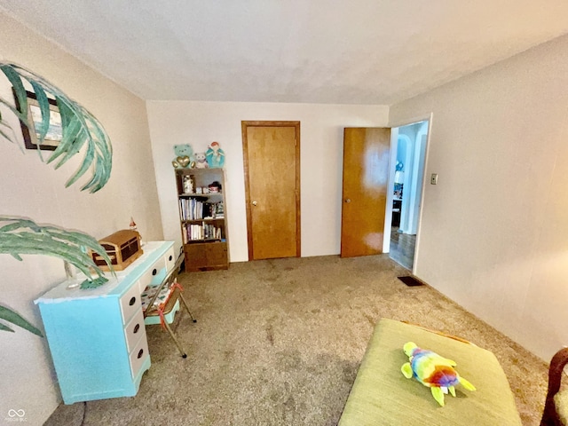 interior space featuring carpet floors and visible vents
