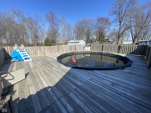 deck featuring a fenced backyard