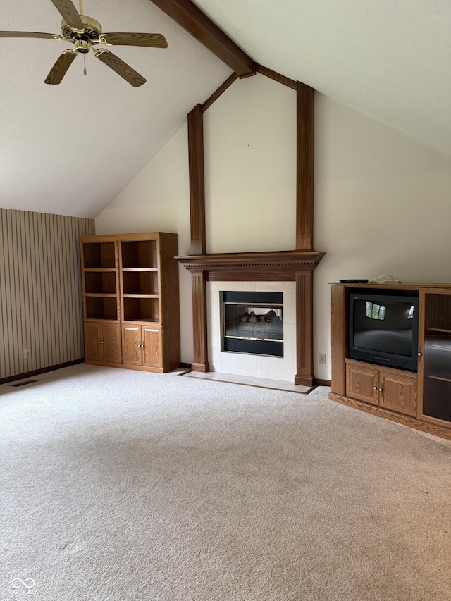 unfurnished living room featuring visible vents, a fireplace, ceiling fan, high vaulted ceiling, and carpet flooring