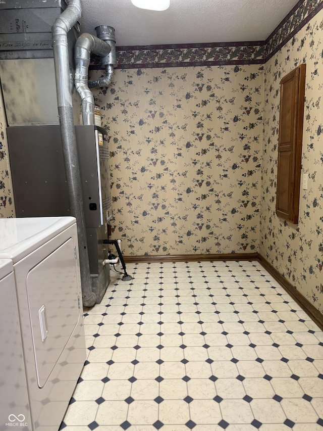 washroom featuring washer and dryer, wallpapered walls, laundry area, and light floors