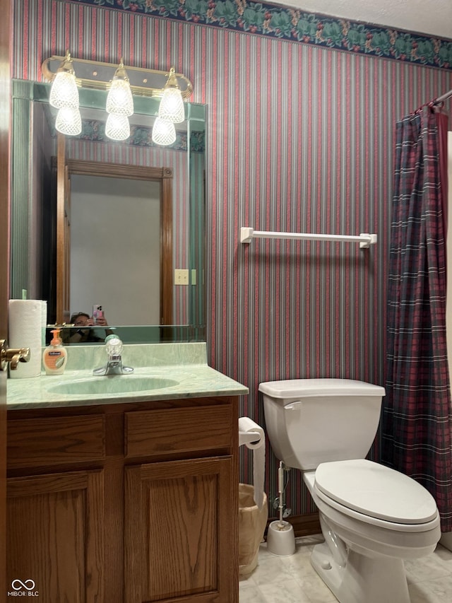 full bathroom with vanity, wallpapered walls, toilet, and a shower with shower curtain