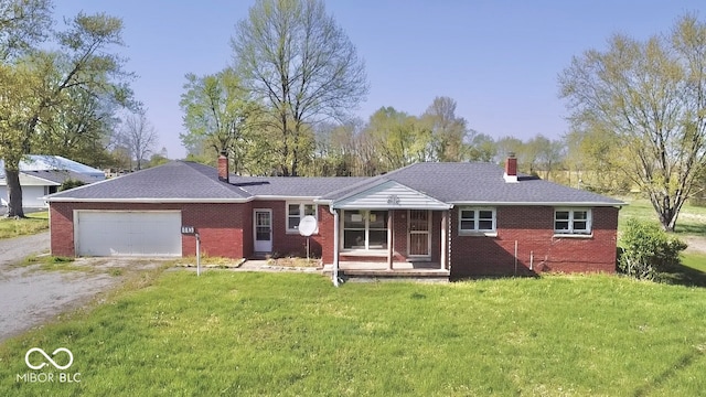 ranch-style home featuring brick siding, a front lawn, and a chimney
