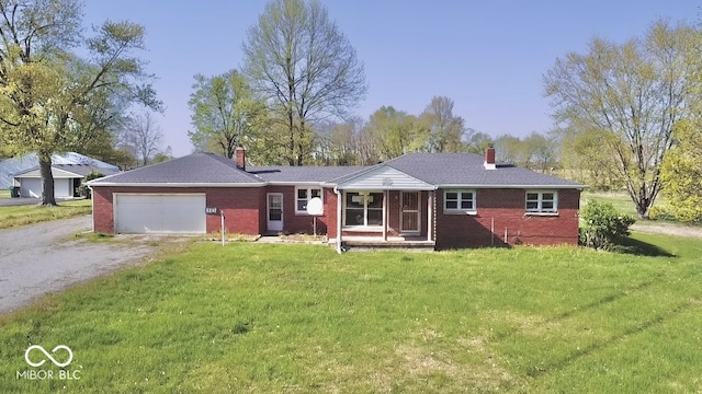 ranch-style house featuring brick siding, a chimney, a front yard, and dirt driveway