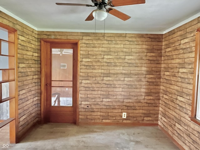 empty room featuring concrete floors and ceiling fan
