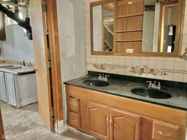 bathroom featuring backsplash, a sink, and unfinished concrete floors