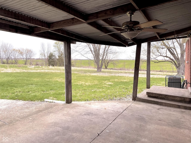 view of patio / terrace with a ceiling fan and central AC unit