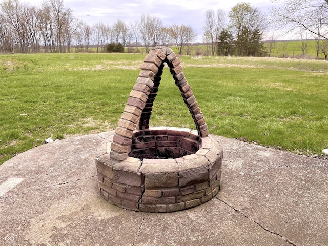 exterior details featuring an outdoor fire pit