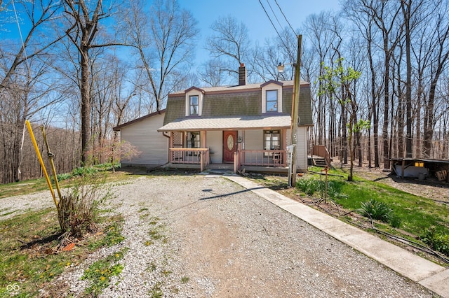 8847 E Northshore Dr, Unionville, IN 47468 - view of front facade with roof with shingles, a gambrel roof, covered porch, and a chimney