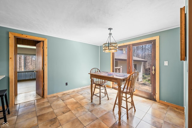 8847 E Northshore Dr, Unionville, IN 47468 - dining room featuring a notable chandelier, baseboards, crown molding, and radiator