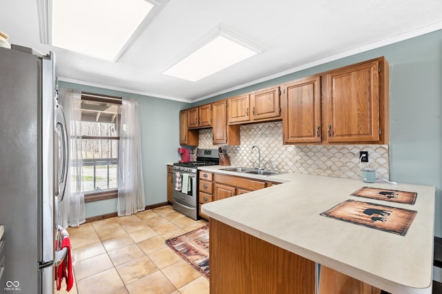 8847 E Northshore Dr, Unionville, IN 47468 - kitchen featuring a peninsula, tasteful backsplash, appliances with stainless steel finishes, light countertops, and a sink