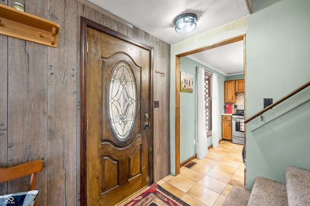 8847 E Northshore Dr, Unionville, IN 47468 - entrance foyer featuring crown molding, visible vents, light tile patterned floors, and stairs