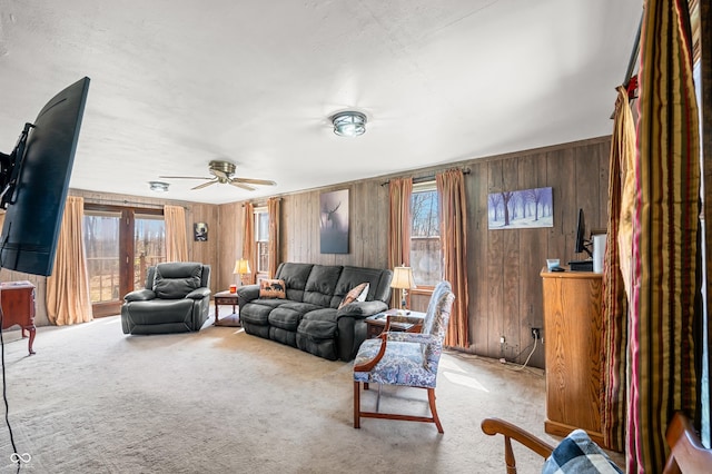 8847 E Northshore Dr, Unionville, IN 47468 - living area featuring wooden walls, ceiling fan, and carpet