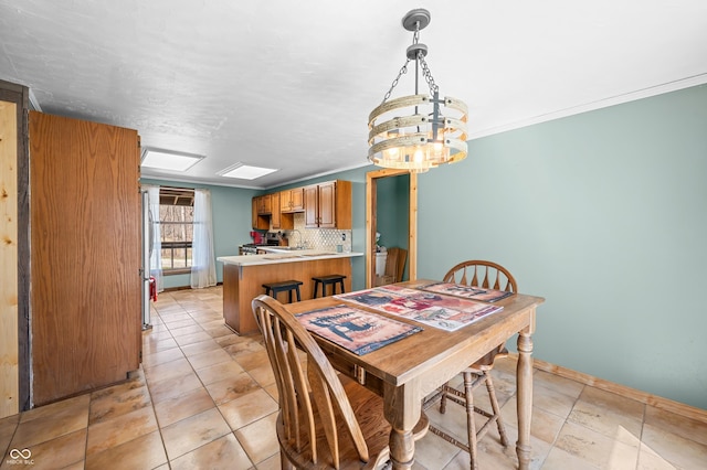 8847 E Northshore Dr, Unionville, IN 47468 - dining area with light tile patterned floors, a notable chandelier, baseboards, and ornamental molding