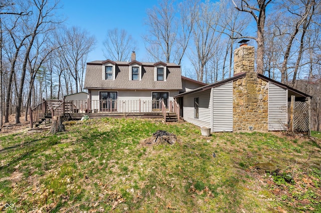 8847 E Northshore Dr, Unionville, IN 47468 - rear view of house featuring a yard, a chimney, a wooden deck, a gambrel roof, and roof with shingles