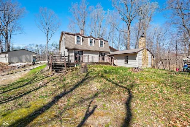 8847 E Northshore Dr, Unionville, IN 47468 - back of property with roof with shingles, a gambrel roof, a chimney, and a wooden deck