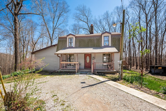 8847 E Northshore Dr, Unionville, IN 47468 - view of front facade with roof with shingles, a gambrel roof, covered porch, and a chimney