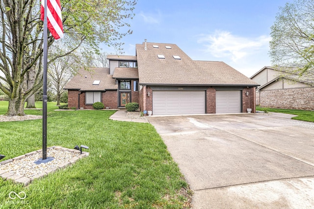 mid-century modern home with concrete driveway, roof with shingles, a front yard, an attached garage, and brick siding
