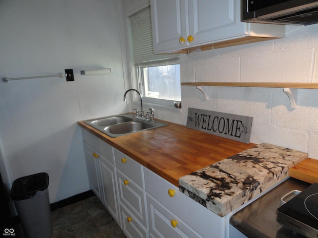 1722 N Parker Ave, Indianapolis, IN 46218 - kitchen featuring a sink and wood counters