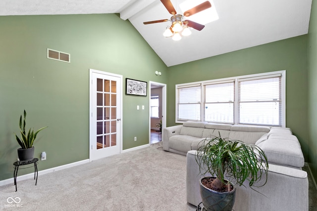 carpeted living area featuring baseboards, visible vents, beamed ceiling, a ceiling fan, and high vaulted ceiling