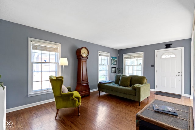 living room featuring baseboards and wood finished floors