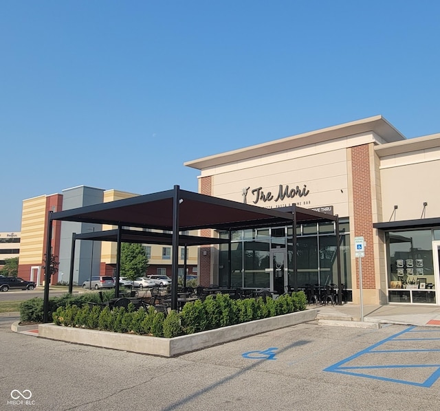 view of building exterior featuring uncovered parking