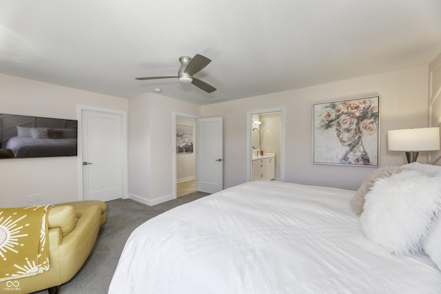 carpeted bedroom featuring baseboards, ceiling fan, and ensuite bathroom