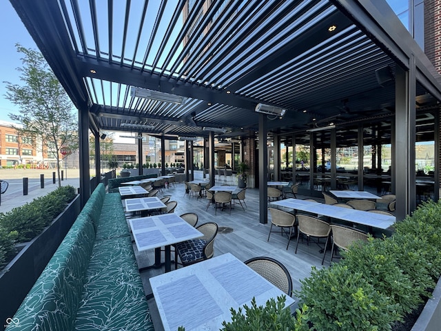 view of patio with ceiling fan and outdoor dining space