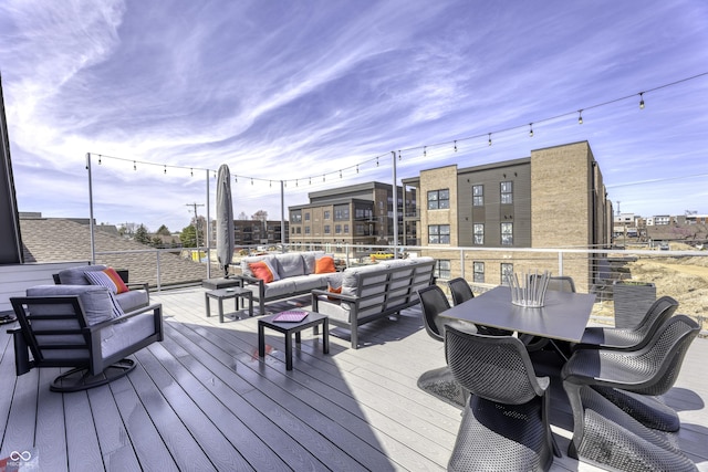 wooden deck featuring an outdoor hangout area and outdoor dining space