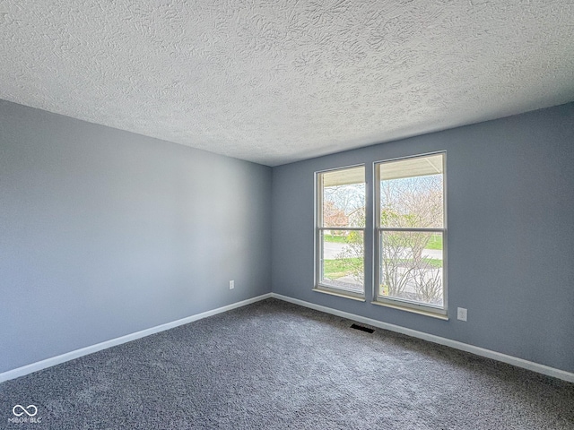 9362 Helmsdale Dr, Indianapolis, IN 46256 - carpeted empty room featuring a textured ceiling and baseboards