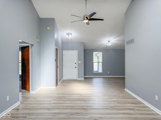 9362 Helmsdale Dr, Indianapolis, IN 46256 - unfurnished living room with light wood-style floors, visible vents, baseboards, and ceiling fan