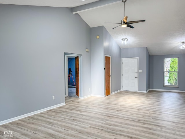 9362 Helmsdale Dr, Indianapolis, IN 46256 - unfurnished living room featuring high vaulted ceiling, light wood-style floors, baseboards, and ceiling fan