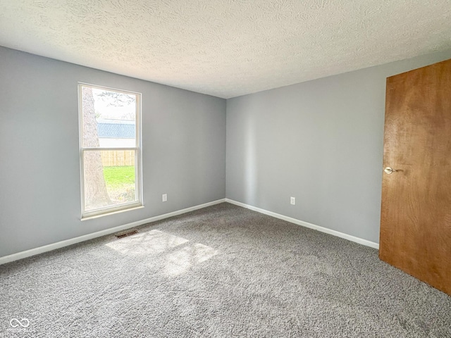 9362 Helmsdale Dr, Indianapolis, IN 46256 - carpeted empty room with baseboards, visible vents, and a textured ceiling