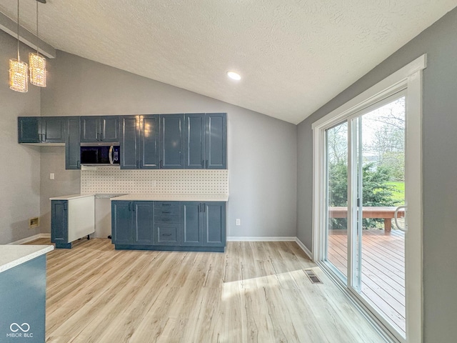 9362 Helmsdale Dr, Indianapolis, IN 46256 - interior space with lofted ceiling, visible vents, light wood-style floors, baseboards, and a textured ceiling