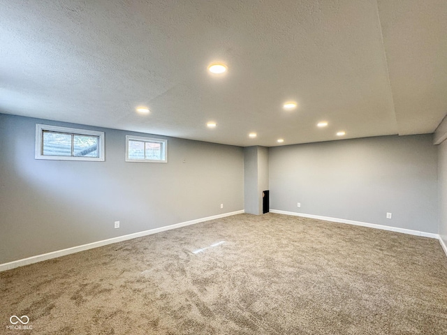 9362 Helmsdale Dr, Indianapolis, IN 46256 - basement featuring recessed lighting, a textured ceiling, carpet flooring, and baseboards