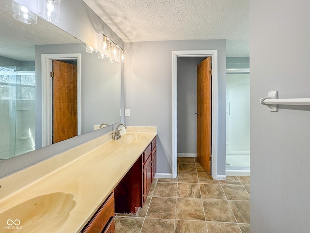 9362 Helmsdale Dr, Indianapolis, IN 46256 - bathroom with double vanity, a textured ceiling, a stall shower, and a sink