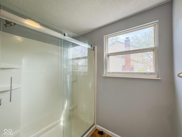 9362 Helmsdale Dr, Indianapolis, IN 46256 - full bath featuring baseboards, a textured ceiling, and a stall shower