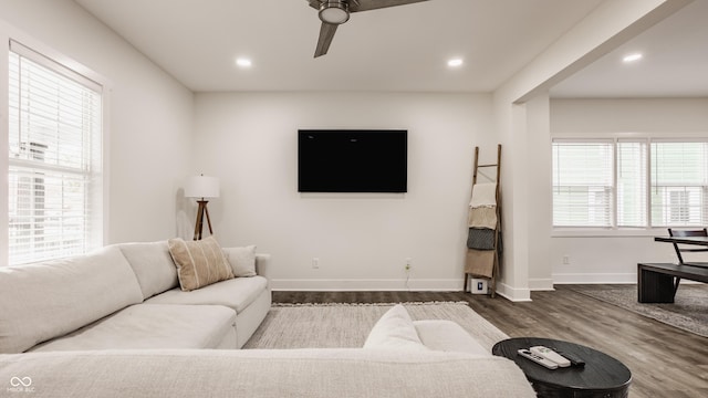 living area with recessed lighting, baseboards, a ceiling fan, and dark wood-style flooring