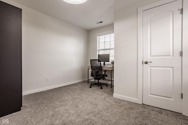 carpeted office featuring baseboards and visible vents