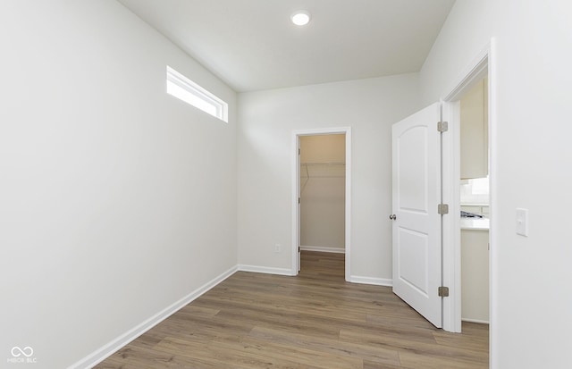 827 Allandale Ave, Westfield, IN 46074 - unfurnished bedroom with a spacious closet, light wood-style floors, baseboards, and a closet