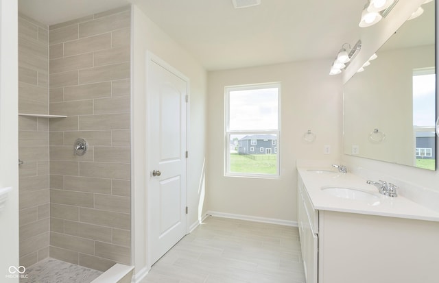 827 Allandale Ave, Westfield, IN 46074 - full bathroom featuring double vanity, tiled shower, and baseboards