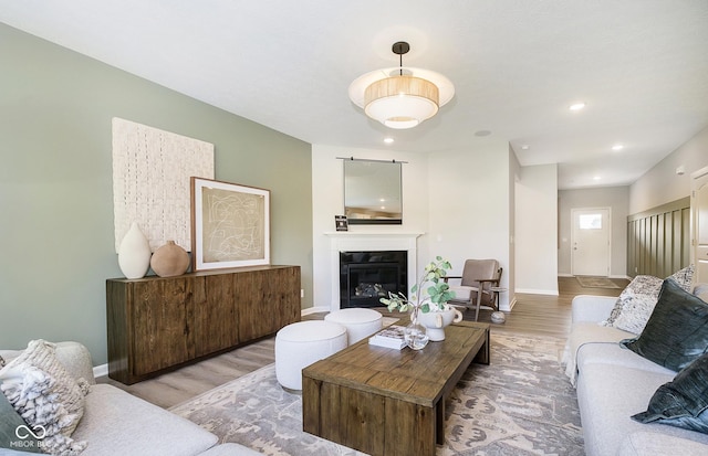 827 Allandale Ave, Westfield, IN 46074 - living room with wood finished floors, baseboards, a glass covered fireplace, and recessed lighting