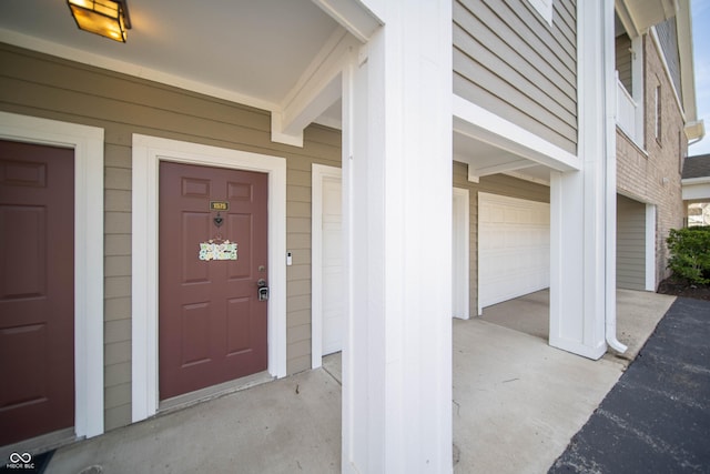 doorway to property featuring a garage