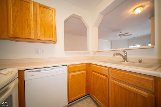 kitchen featuring a sink, light countertops, a ceiling fan, and white appliances