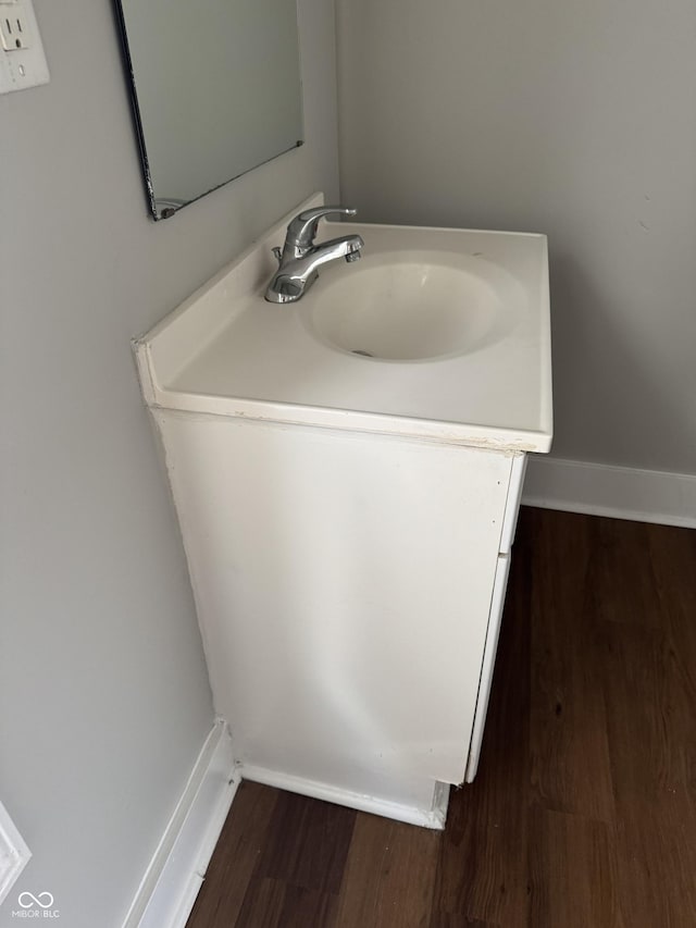 3502 N Illinois St, Indianapolis, IN 46208 - bathroom featuring wood finished floors, vanity, and baseboards