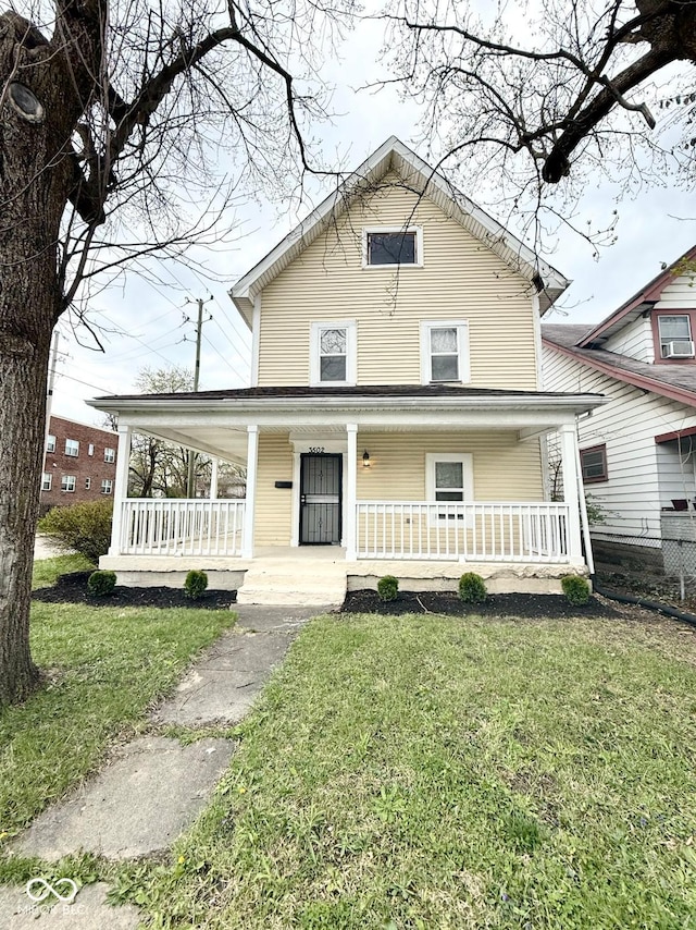3502 N Illinois St, Indianapolis, IN 46208 - farmhouse with a porch and a front lawn